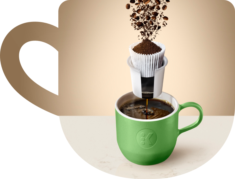 Diagram of a broken down K-Cup pod emptying into a coffee mug