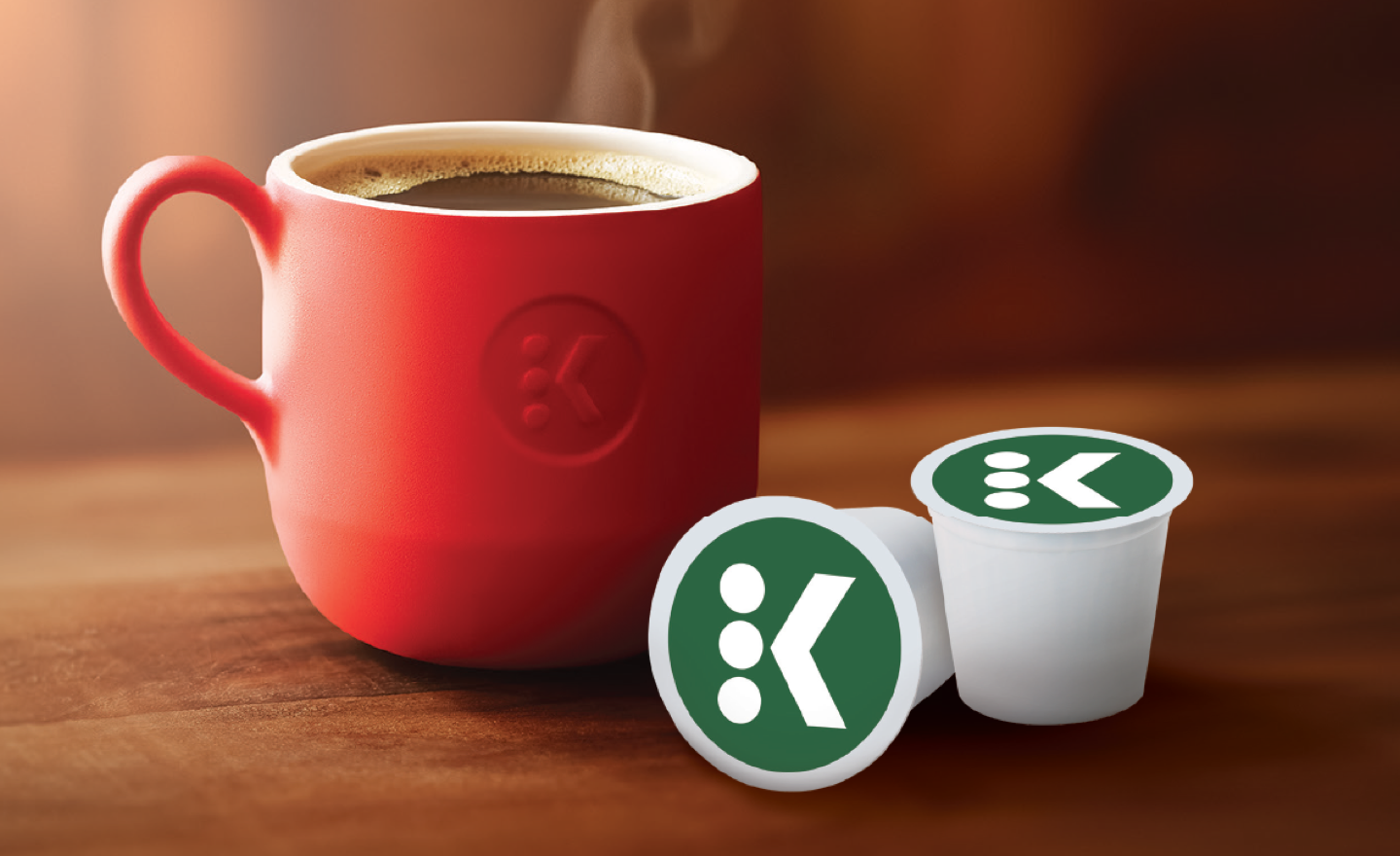 Warm mug of coffee next to two K-Cup pods